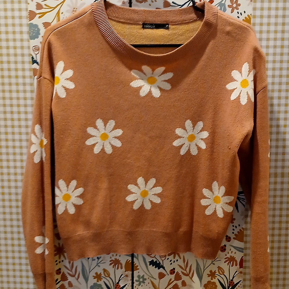 Women's sweater with white daisy all over.